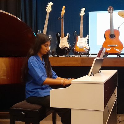 Dhara Shah 9N playing the piano.jpg